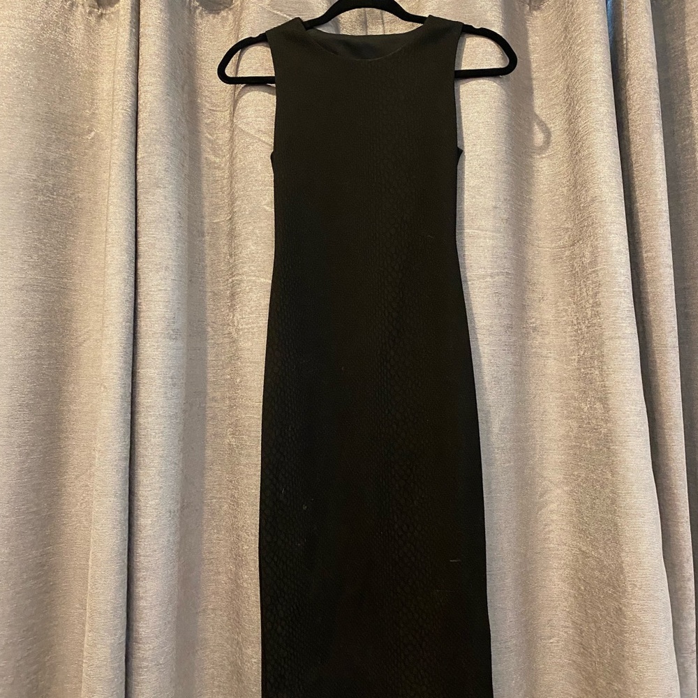 Little black dress with gold black zipper and back cut it